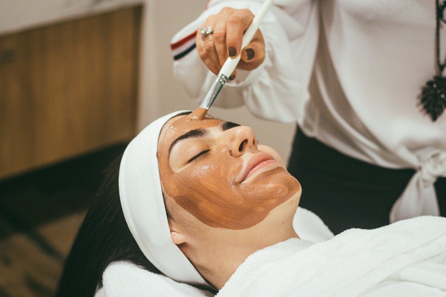 Guest relaxing with a facial mask